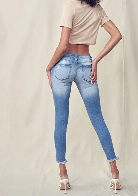 Low Rise Skinny Jeans with Distressed Ankles